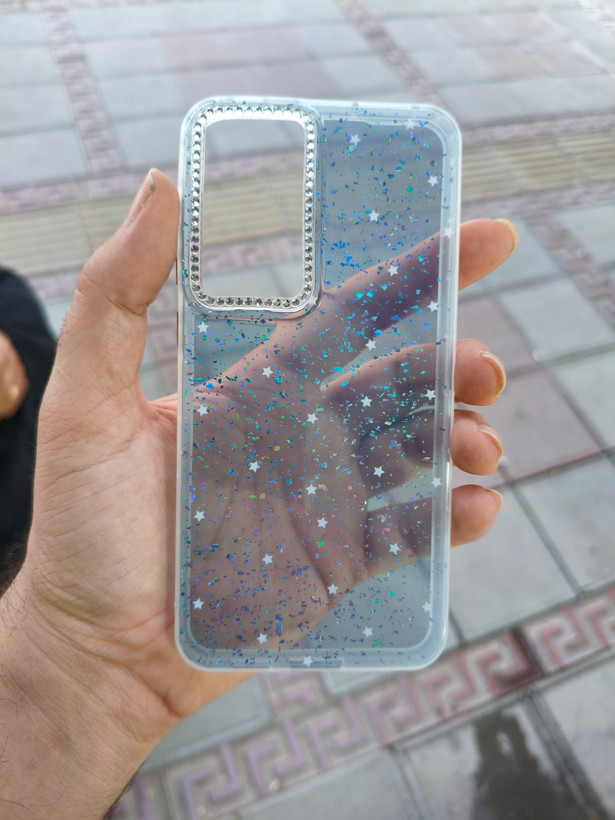 قاب فانتزی شاین دار اکلیلی رزینی ستاره دار دور دوربین نگین کار شده گوشی Samsung S25FE