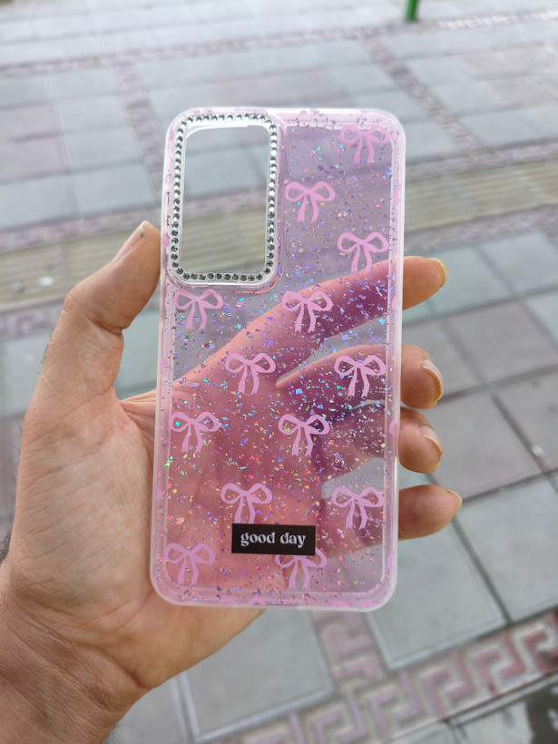 قاب فانتزی شاین دار اکلیلی پاپیونی دور دوربین نگین کار شده گوشی Samsung S25FE