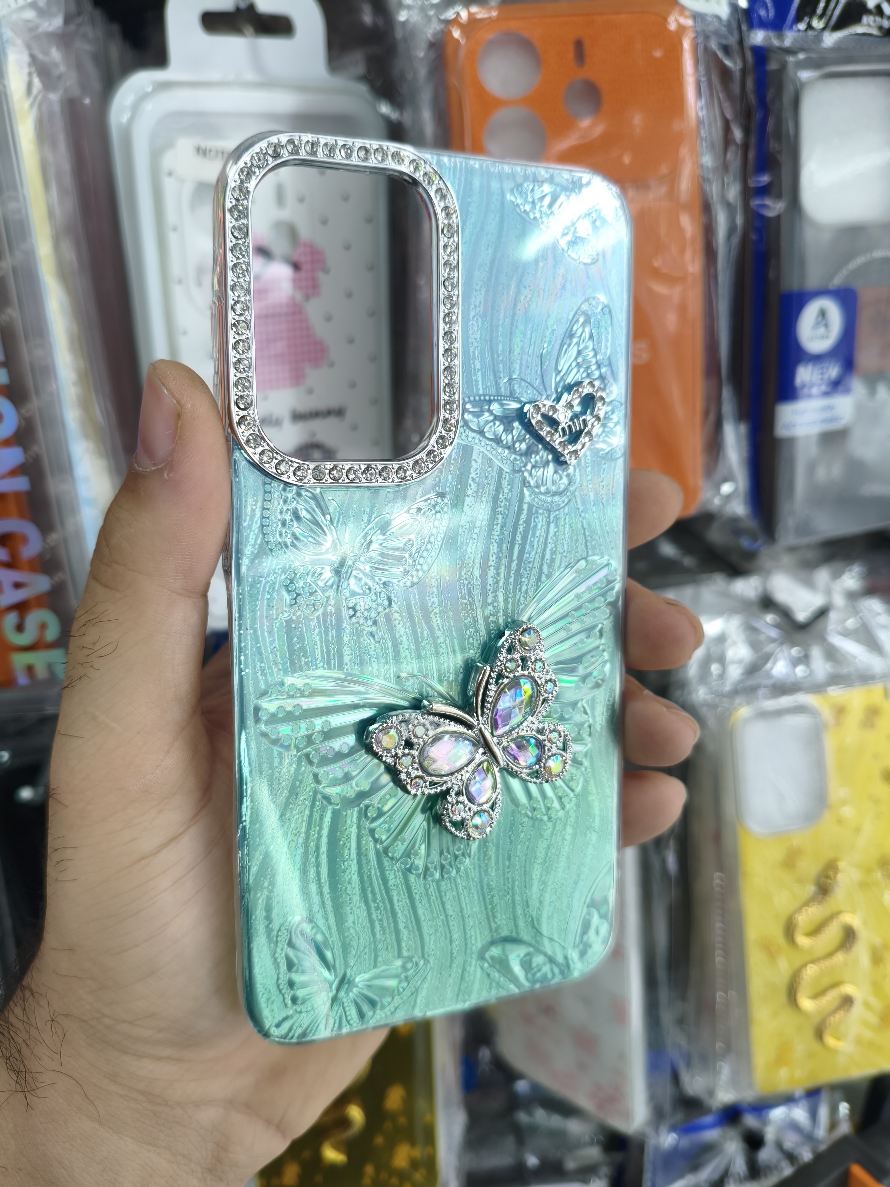 قاب گوشی Samsung A36/A56 طرح پروانه نگین‌دار رنگ آبی فیروزه ای